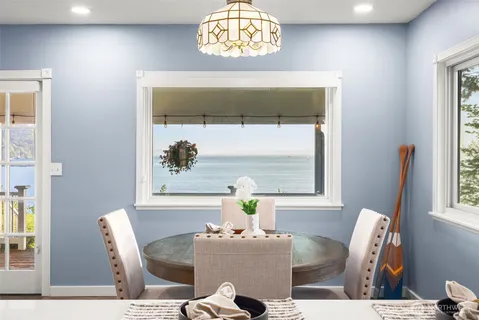 a dining room with furniture and window
