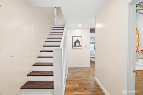 a view of an entryway with wooden floor