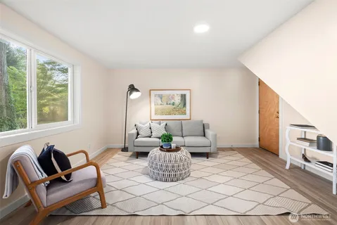 a bedroom with a bed and a potted plant
