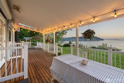 a view of a deck with chair and wooden floor