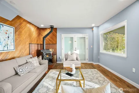 a living room with furniture and a rug