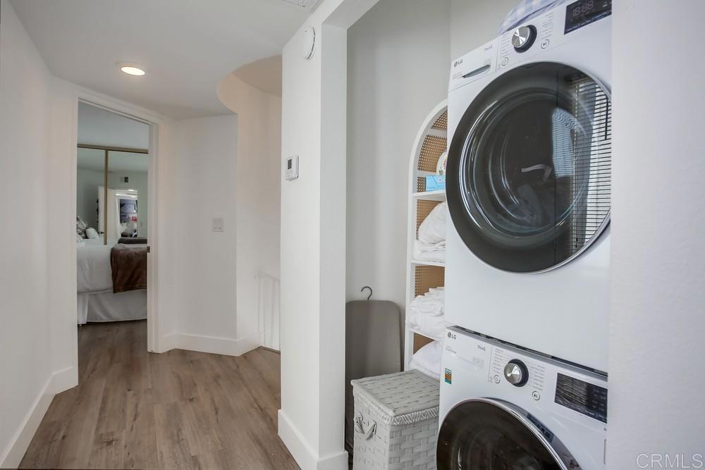 2630 Pirineos Way, Unit 11 Carlsbad, CA 92009 - Photo 12 of 28 a view of livingroom with washer and dryer