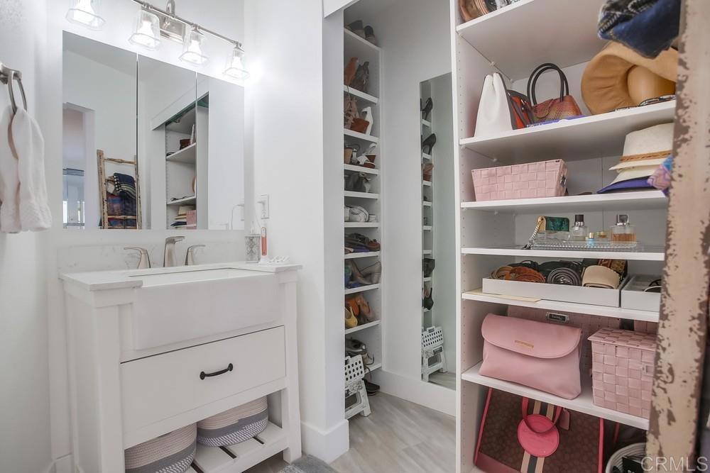 2630 Pirineos Way, Unit 11 Carlsbad, CA 92009 - Photo 20 of 28 a bathroom with a sink and a mirror