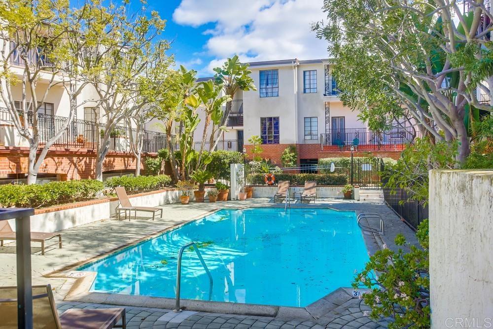 2630 Pirineos Way, Unit 11 Carlsbad, CA 92009 - Photo 22 of 28 a view of a swimming pool with a patio