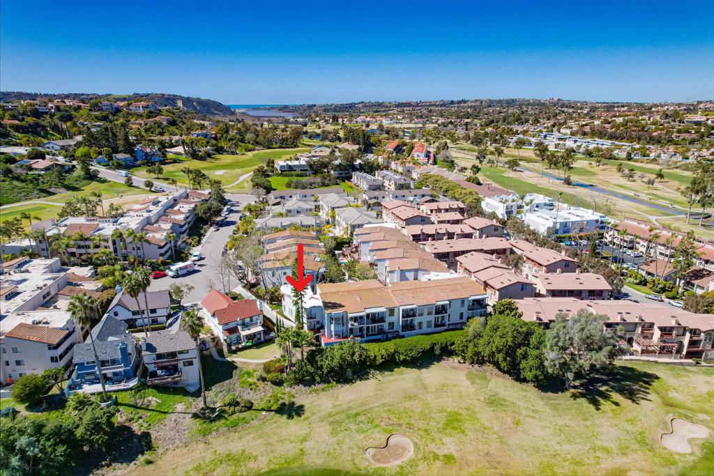 2630 Pirineos Way, Unit 11 Carlsbad, CA 92009 - Photo 25 of 28 an aerial view of residential houses with outdoor space and trees