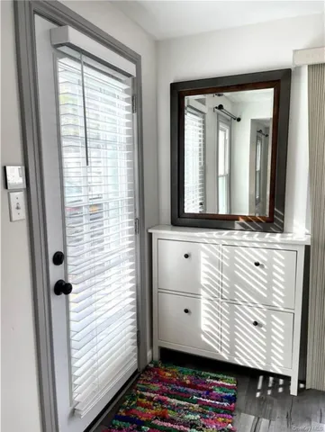 a view of bathroom with a sink and mirror