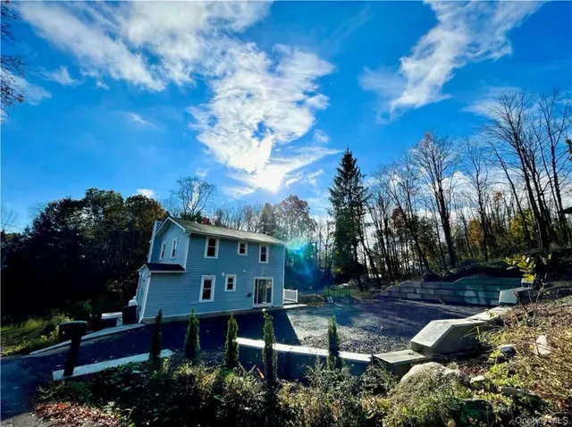 a view of house with outdoor space