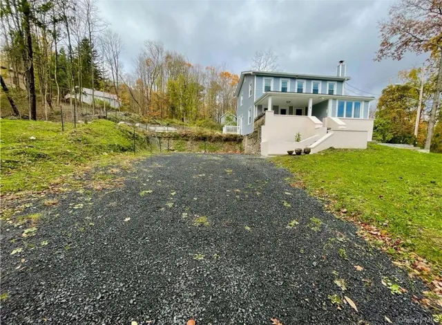 a view of a back yard of the house
