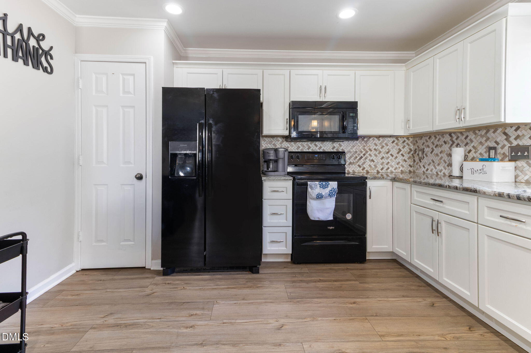 3713 Marshlane Way Raleigh, NC 27610 - Photo 16 of 38 a kitchen with stainless steel appliances granite countertop a refrigerator and a stove top oven