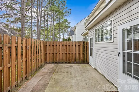 a view of a porch with wooden fence