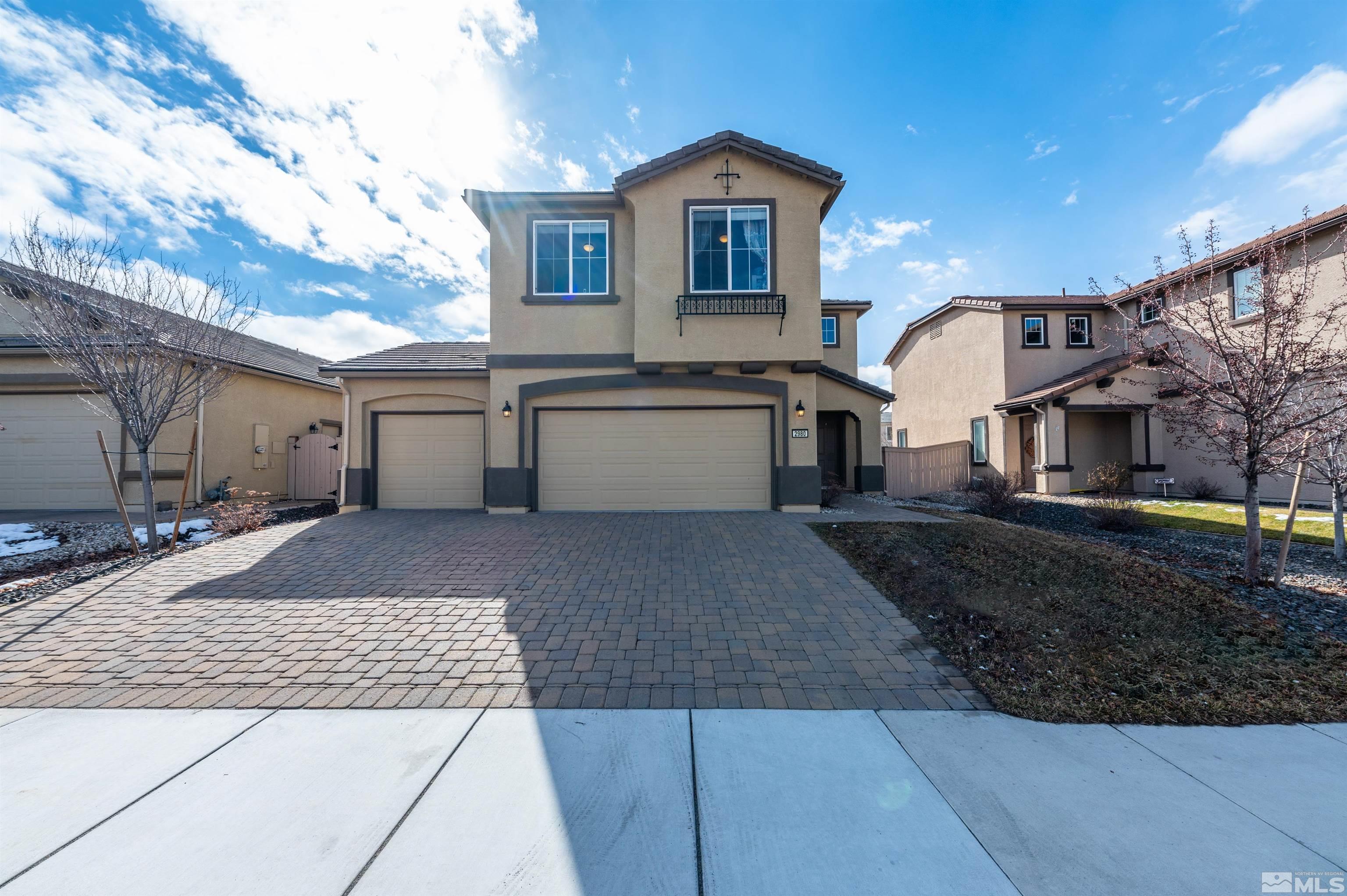 2980 Show Jumper Lane Reno, NV 89521 - Photo 1 of 15 a front view of a house with a yard and garage