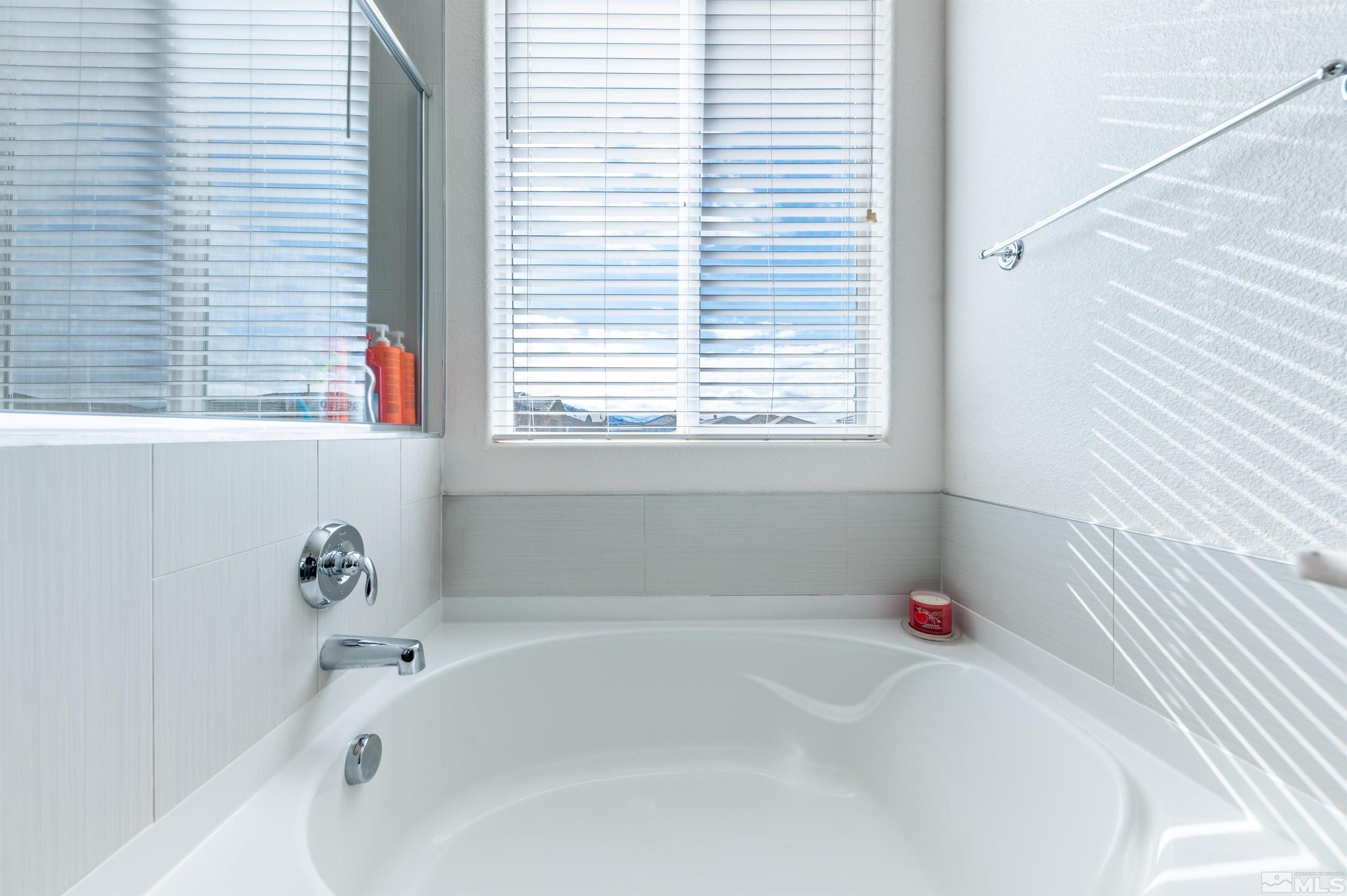 2980 Show Jumper Lane Reno, NV 89521 - Photo 11 of 15 a white bath tub sitting next to a window