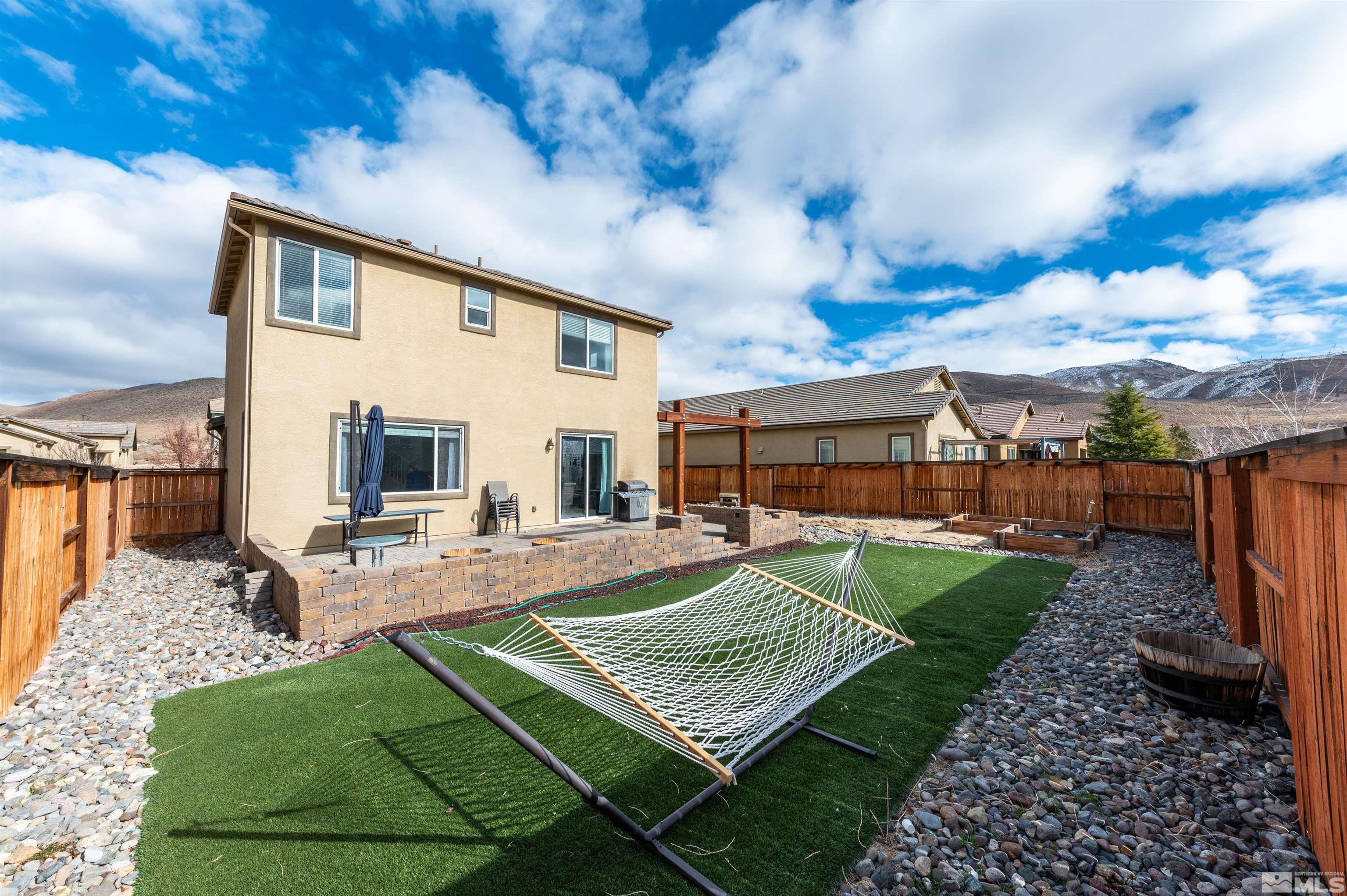 2980 Show Jumper Lane Reno, NV 89521 - Photo 14 of 15 a view of a house with backyard and sitting area