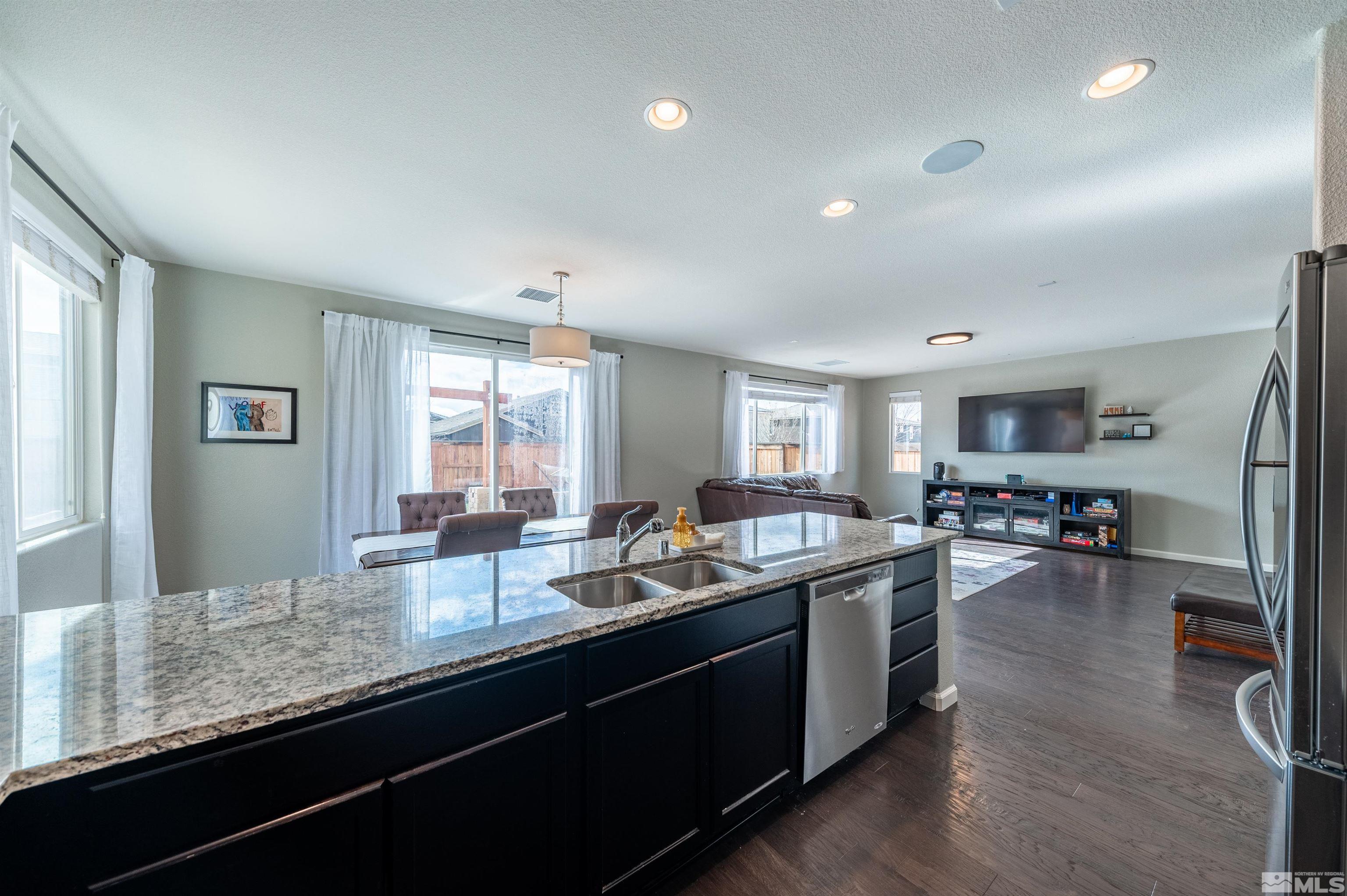 2980 Show Jumper Lane Reno, NV 89521 - Photo 6 of 15 a kitchen with sink and view of living room