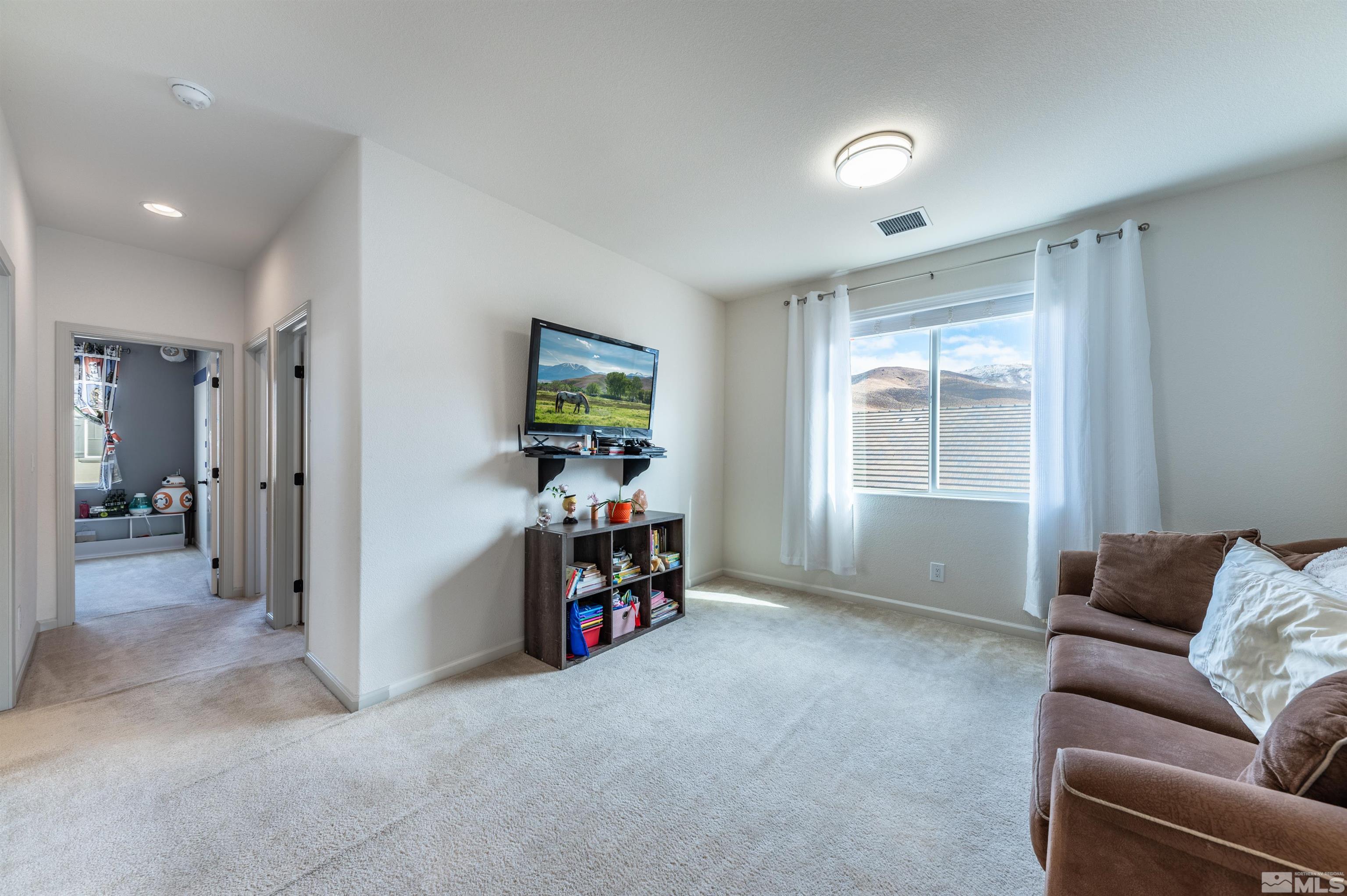 2980 Show Jumper Lane Reno, NV 89521 - Photo 8 of 15 a view of livingroom with furniture and windows