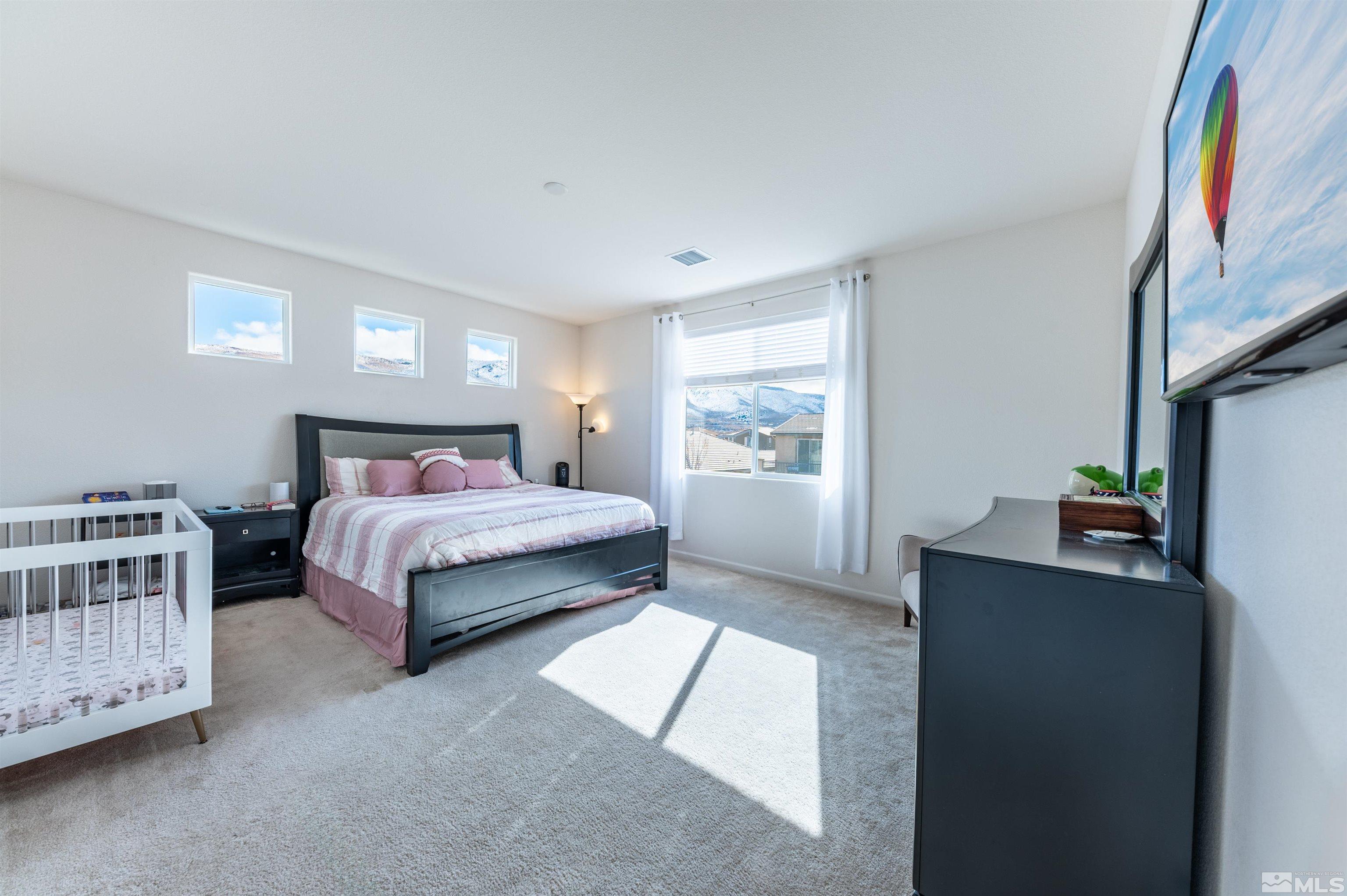 2980 Show Jumper Lane Reno, NV 89521 - Photo 9 of 15 a bedroom with a bed and a window