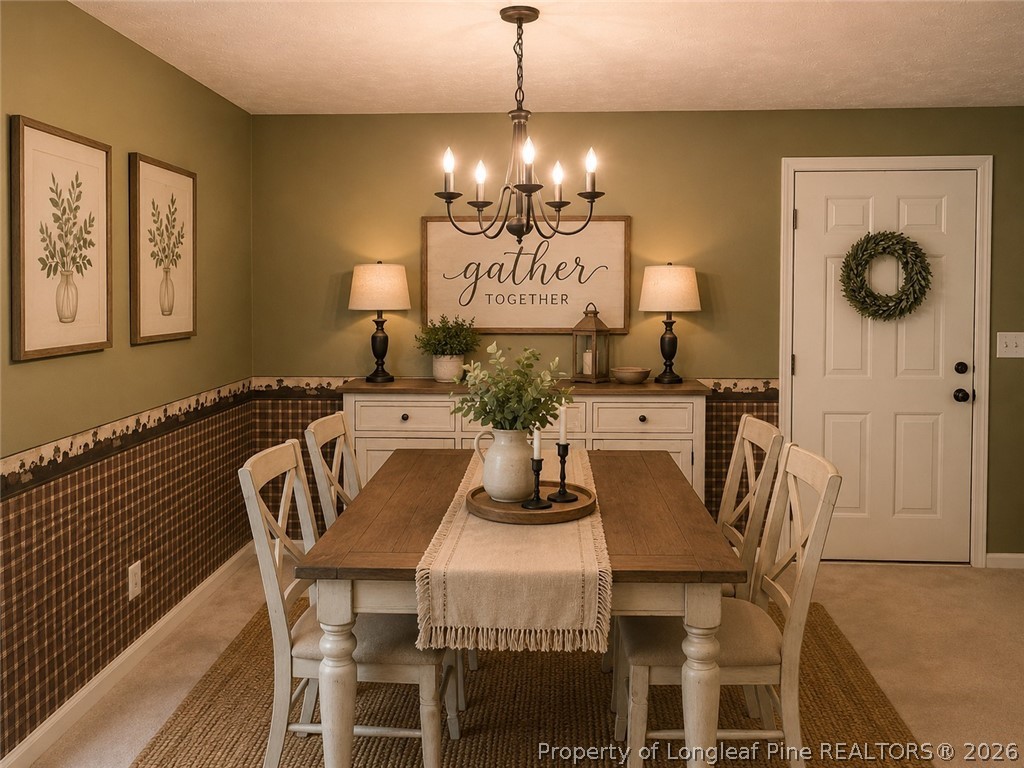 1833 Sardonyx Road, Unit 3 Fayetteville, NC 28303 - Photo 3 of 10 a view of a dining room with furniture and chandelier