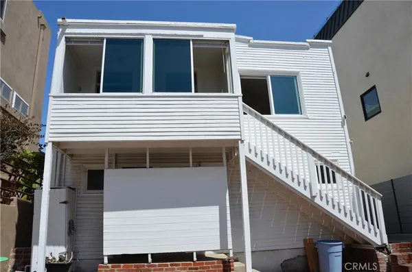 a view of a house with a window and stairs