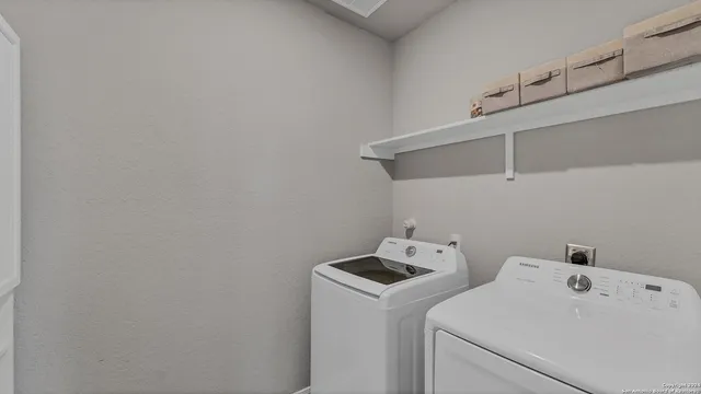 a utility room with dryer and washer