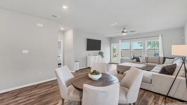 a living room with furniture and flat screen tv