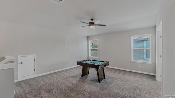 an empty room with windows and entrance