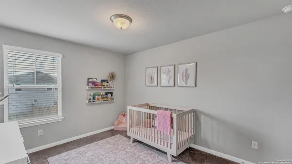 a bedroom with furniture and a window