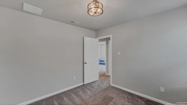 a view of room with racks on the wall