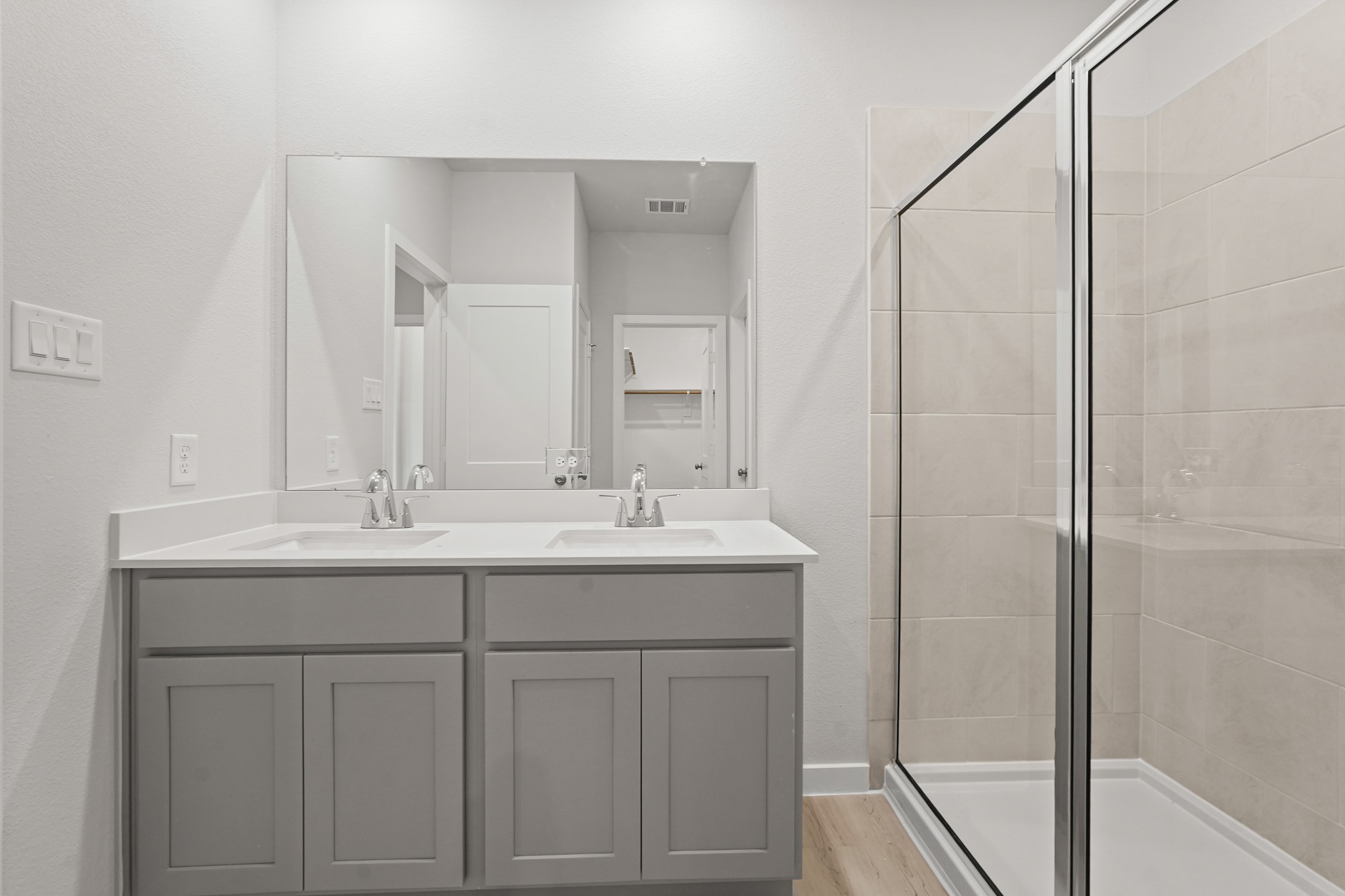 217 Spring Drive Hockley, TX 77447 - Photo 12 of 27 a bathroom with a sink and a mirror