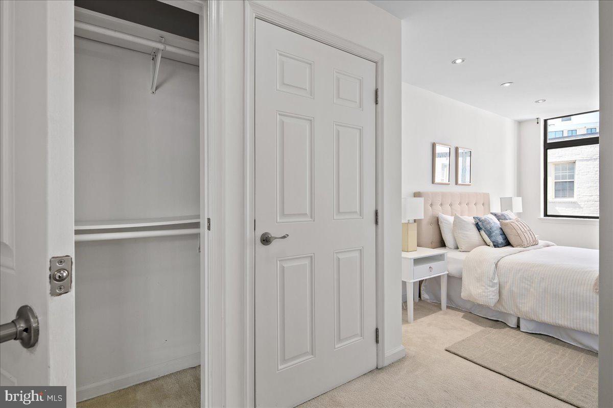 1312 Massachusetts Avenue Northwest, Unit 710 Washington, DC 20005 - Photo 20 of 30 a room with a bed and a closet