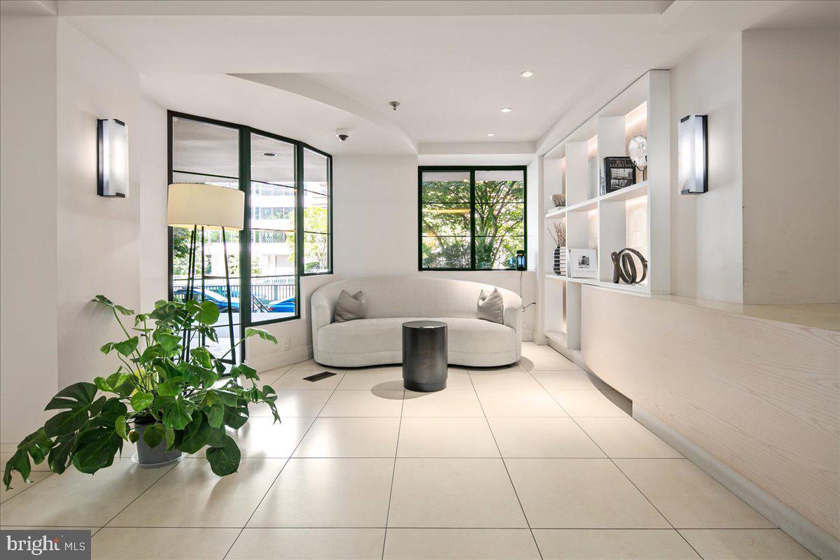 1312 Massachusetts Avenue Northwest, Unit 710 Washington, DC 20005 - Photo 26 of 30 a living room with furniture and a large window