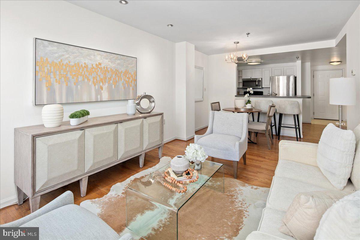 1312 Massachusetts Avenue Northwest, Unit 710 Washington, DC 20005 - Photo 9 of 30 a living room with furniture and a large window