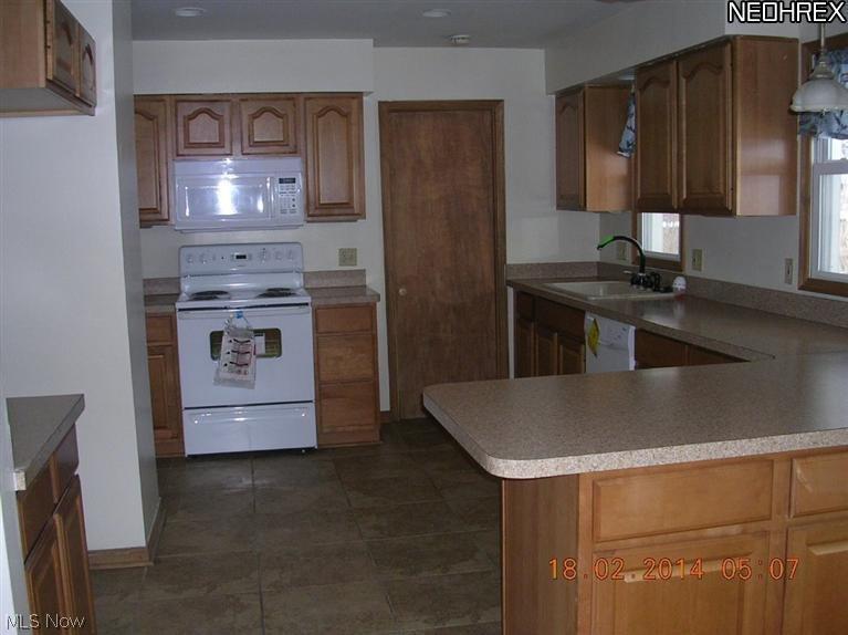 9201 Reichert Road Parma, OH 44130 - Photo 2 of 11 updated kitchen has new appliances, ceramic tile floors and has been freshly painted.