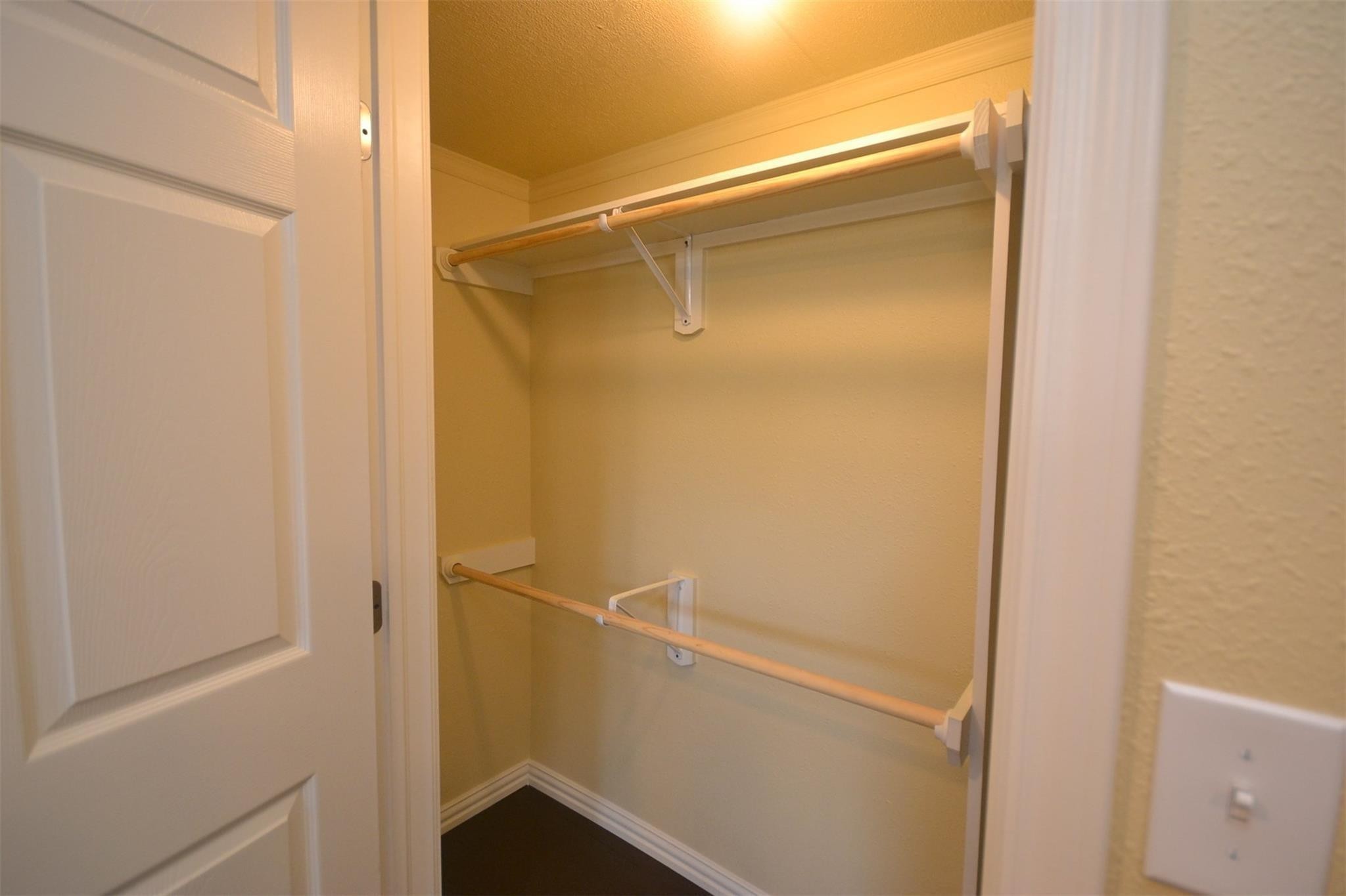 12652 Calvary Road Willis, TX 77318 - Photo 14 of 20 Spacious walk-in closet with dual hanging rods and ample storage space.
