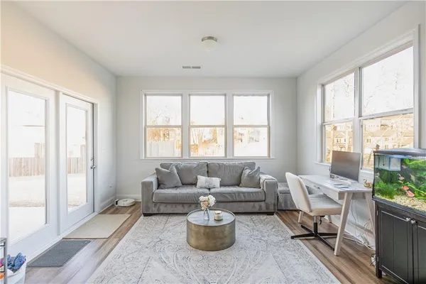 a living room with furniture and a window