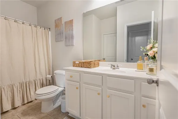 a bedroom with a bed and cabinets