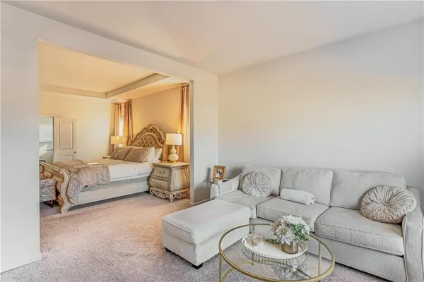 a spacious bathroom with a double vanity sink a mirror and a bathtub