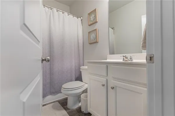 a bedroom with a bed and a table