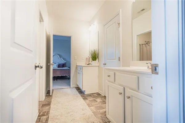 a view of a hallway with closet area