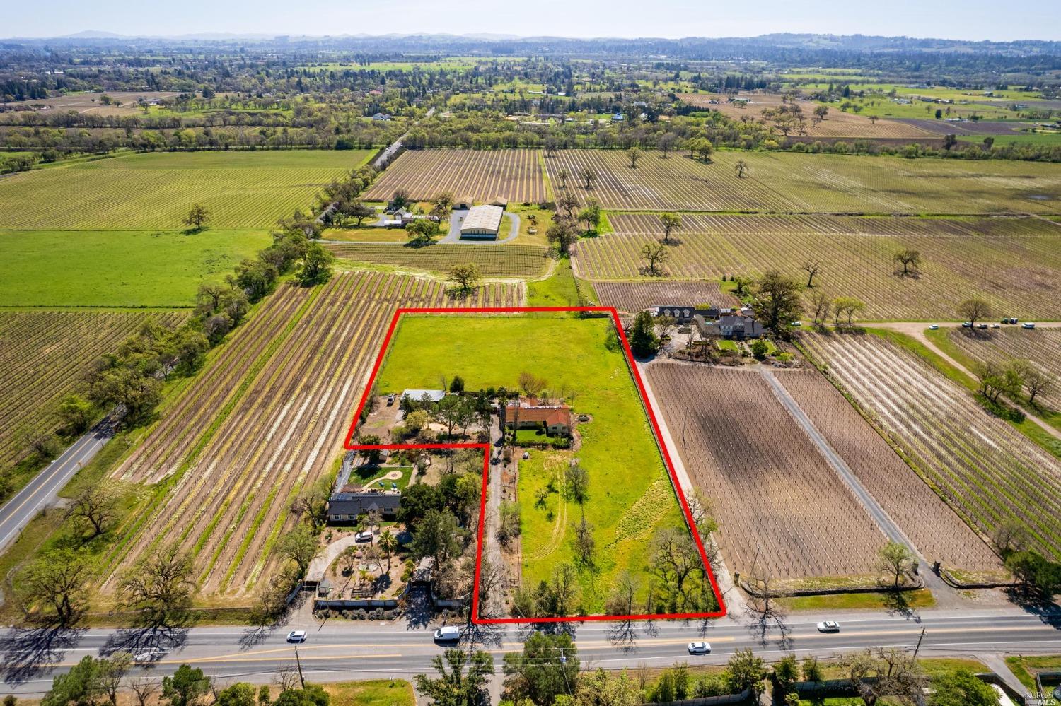 an aerial view of a city with lawn chairs