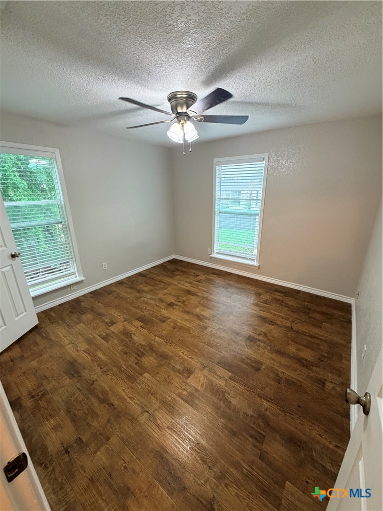 208 Uhland Road, Unit 3 San Marcos, TX 78666 - Photo 7 of 12 an empty room with windows and fan