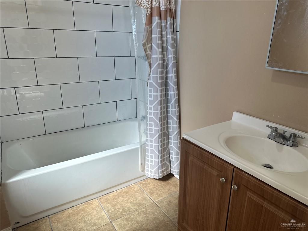 25063 Jesus Flores Road Monte Alto, TX 78538 - Photo 18 of 23 a bathroom with a bathtub and shower