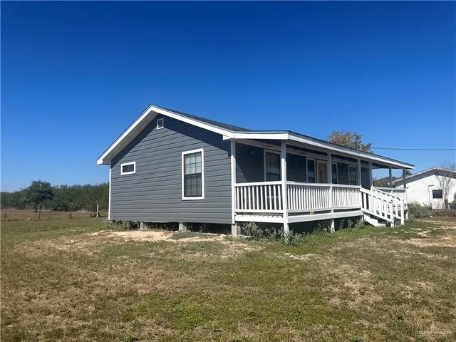 a front of house with a yard