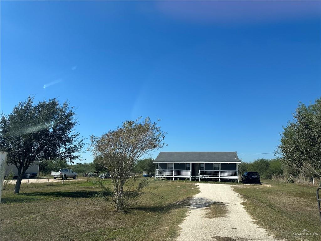 25063 Jesus Flores Road Monte Alto, TX 78538 - Photo 23 of 23 a view of a house with a yard