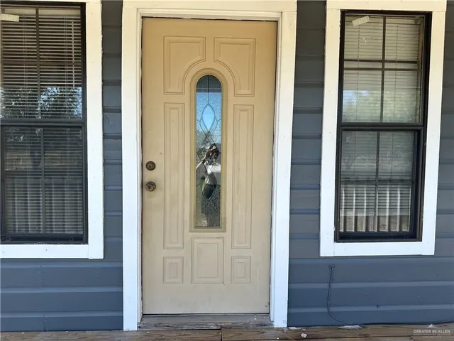 a kitchen with stainless steel appliances granite countertop a stove cabinets and wooden floor