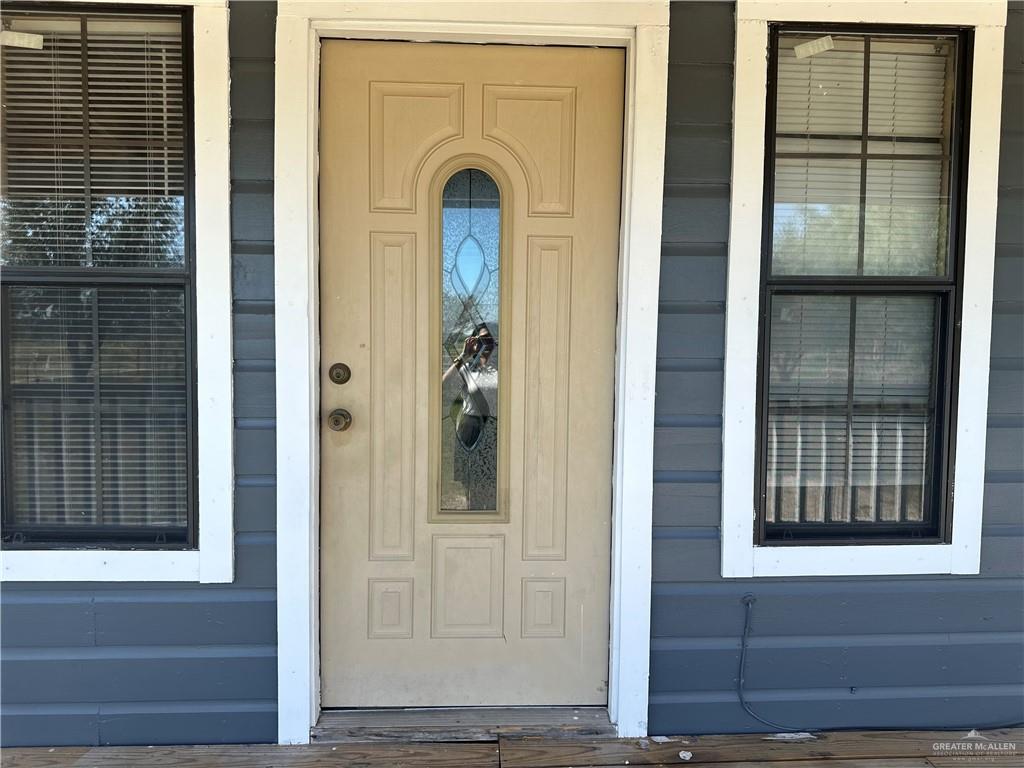 25063 Jesus Flores Road Monte Alto, TX 78538 - Photo 7 of 23 a view of front door of a house