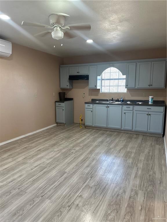 25063 Jesus Flores Road Monte Alto, TX 78538 - Photo 8 of 23 a kitchen with stainless steel appliances granite countertop a stove cabinets and wooden floor
