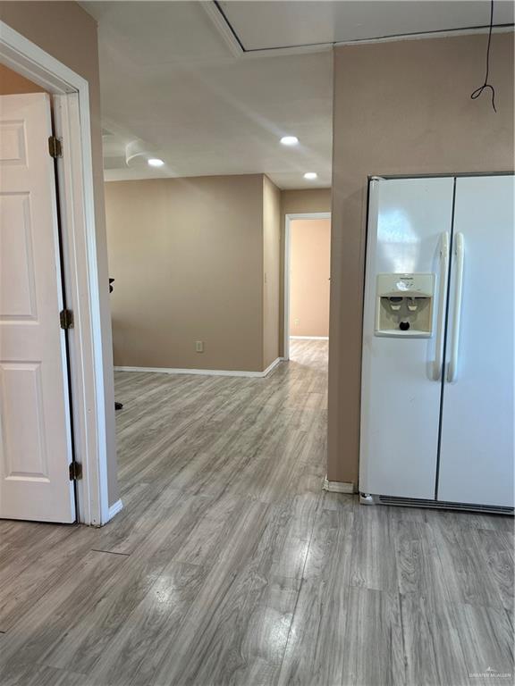 25063 Jesus Flores Road Monte Alto, TX 78538 - Photo 10 of 23 a view of a hallway with wooden floor