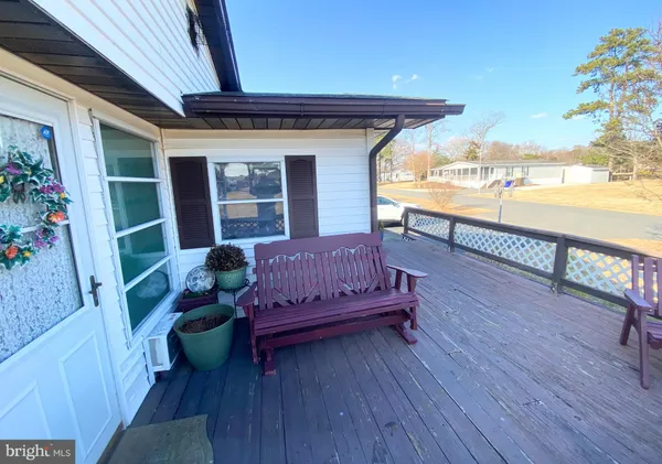 a view of a two chairs in the balcony