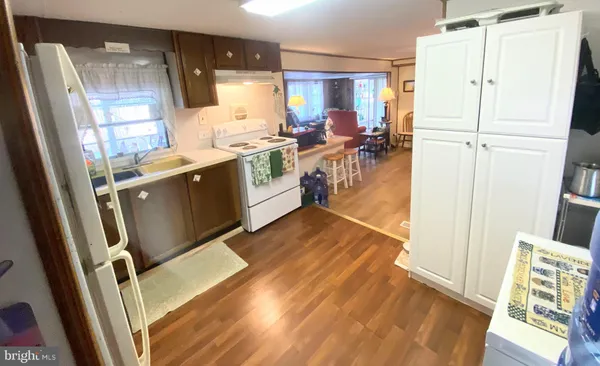 a kitchen with wooden cabinets and sink