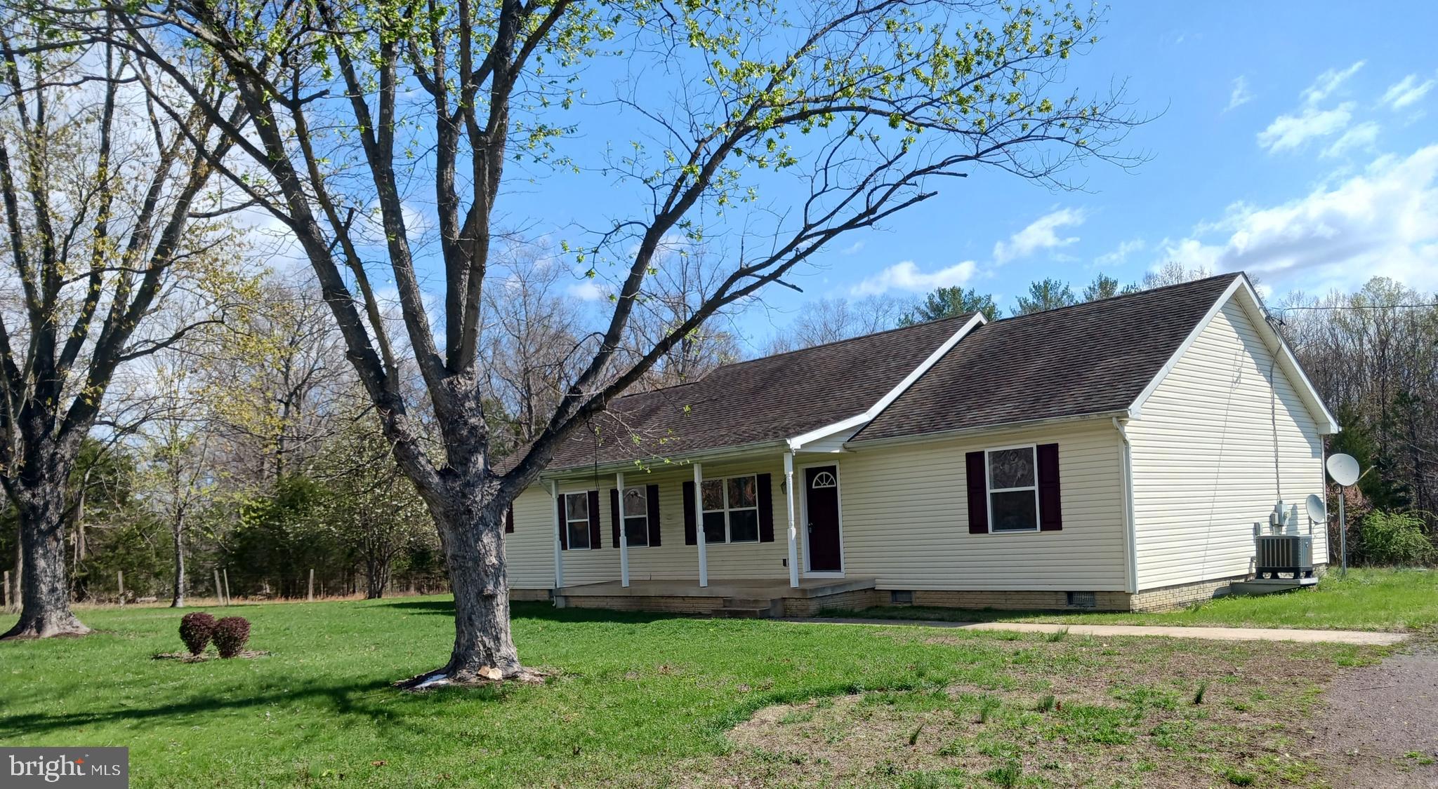 2004 Twymans Mill Road Madison, VA 22727 - Photo 2 of 24 a front view of a house with a garden